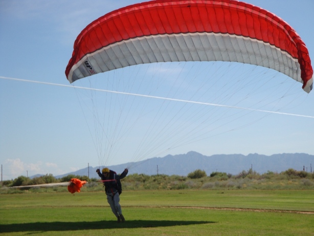 paraglider getting towed into the air