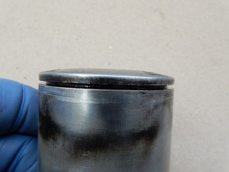 top 80 piston with burned oil in the lands