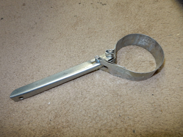 small oil filter wrench used to hold the clutch on the Top 80