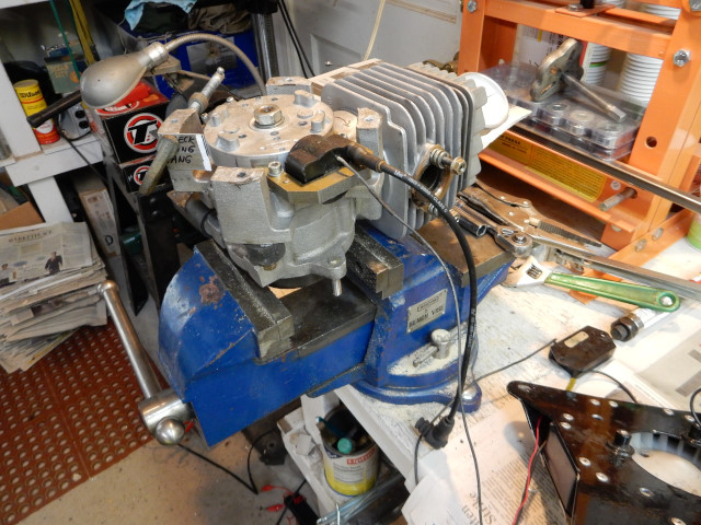 Top 80 engine held in vise by clutch and ready to time