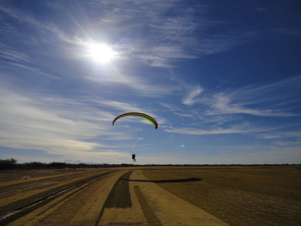 paraglider pilot coming in for a landing